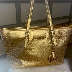 Michael Kors gold tote bag. Like new condition.